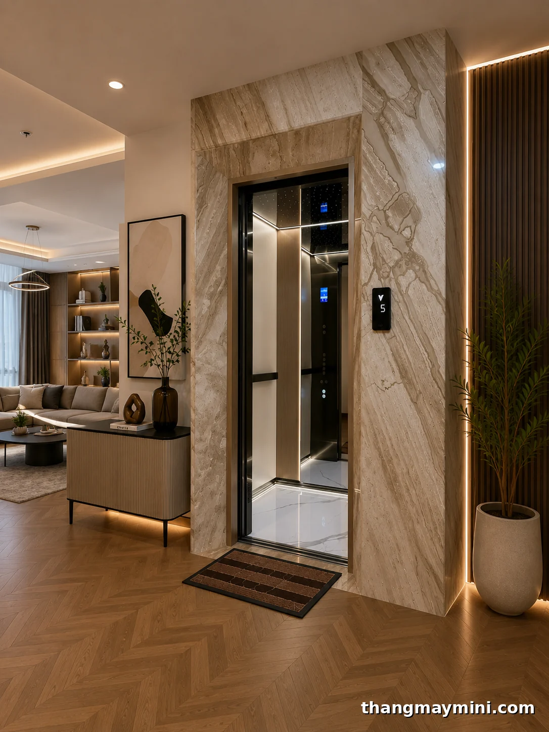 Mẫu thang máy gia đình đẹp ốp đá cabin inox kính lắp trong nhà phố hiện đại